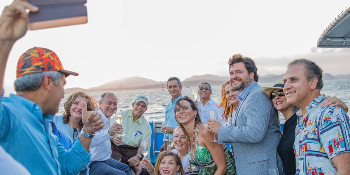 men-and-women-taking-group-picture-using-smartphone-2205683